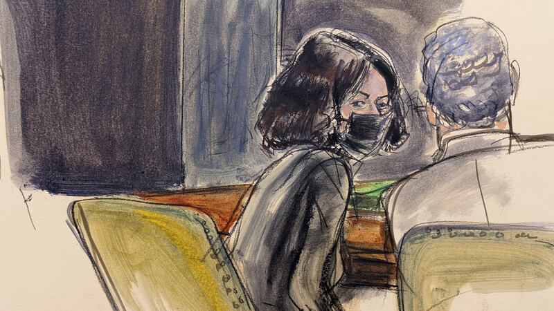 Ghislaine Maxwell, left, speaks to her defense attorney Jeffrey Pagliuca after the reading of...