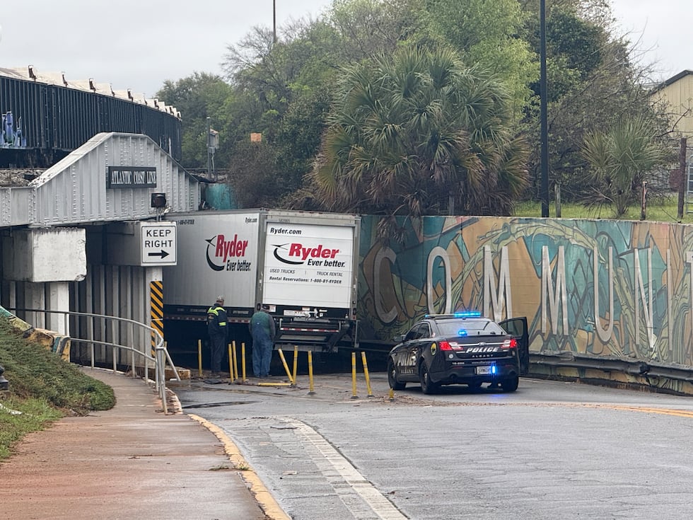 An APD officer Blocks traffic in the East bound lane of East Broad ave. after a Box truck gets...