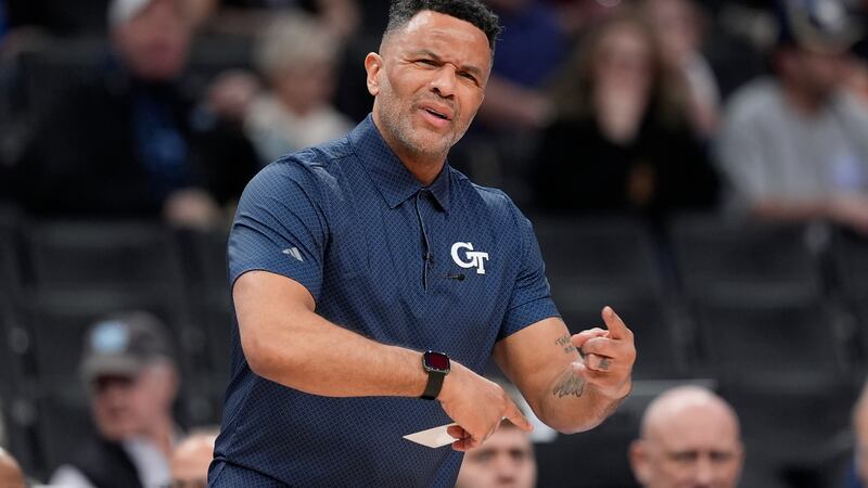 Georgia Tech head coach Damon Stoudamire gesturing to his players during the first half of the...