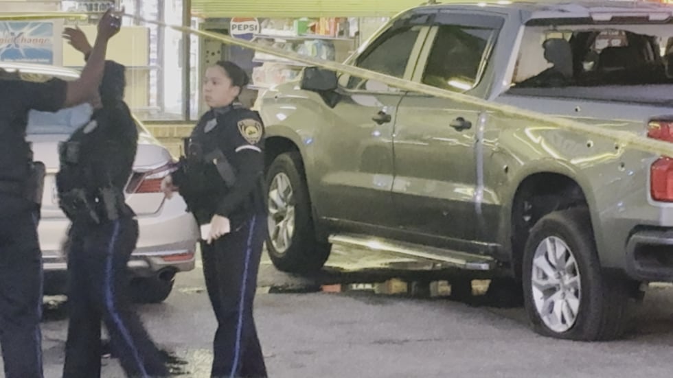 Police found the driver's car riddled with bullets.