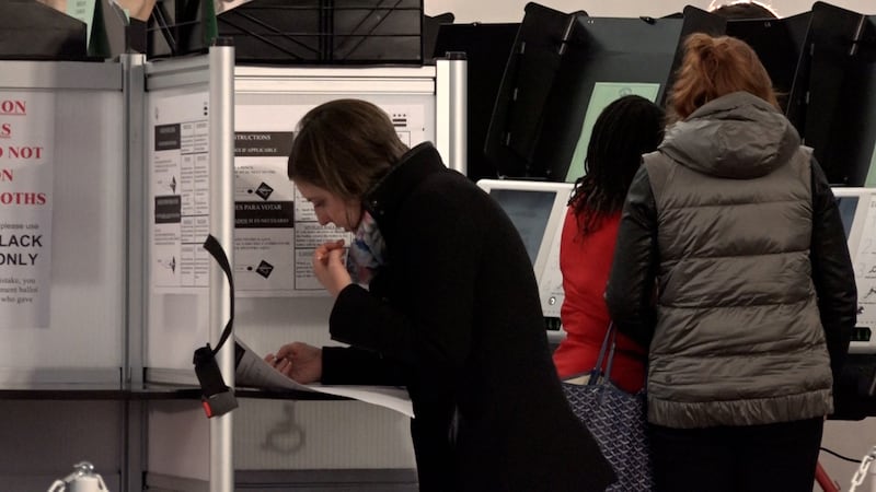 A female voter casts her ballot. The 2026 midterm elections are historic for women, with more...