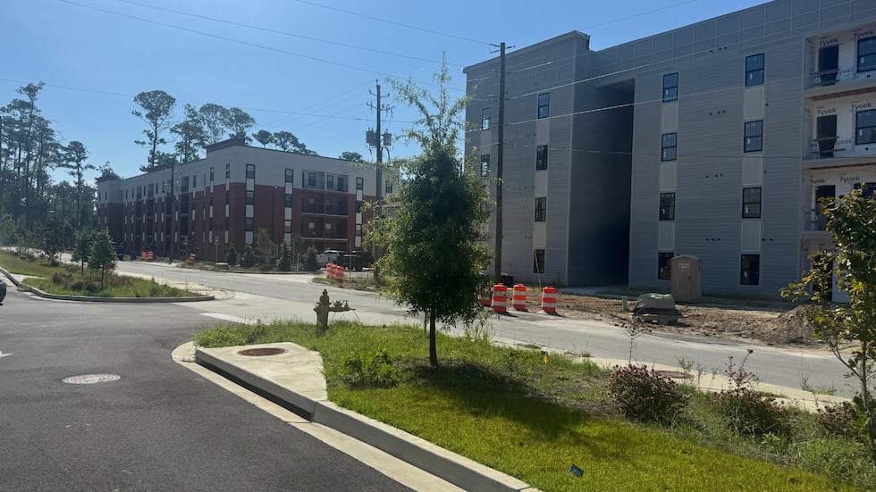 Two buildings occupied, third has no name posted