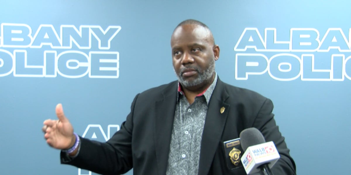 A police chief speaking to a community gathering, encouraging residents to seek resources after a series of incidents