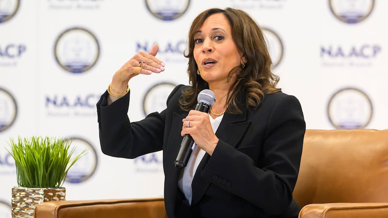 Former Vice President Kamala Harris speaks with the Rev. Wendell Anthony, President of the...