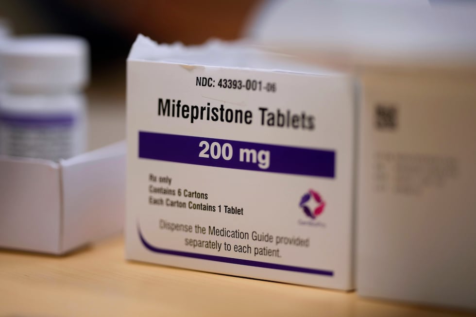 FILE - Mifepristone tablets sit on a table at a Planned Parenthood clinic in Ames, Iowa, July...