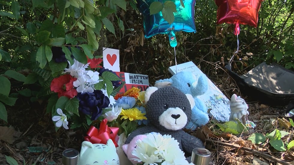 The memorial is set up in the wooded area of where Clark was found.