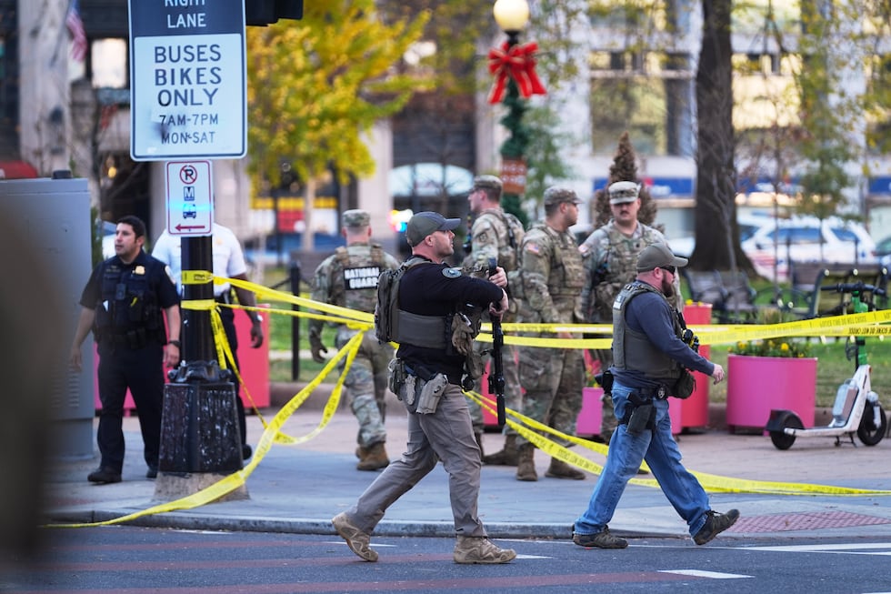 U.S. Marshals and National Guard troops are seen after reports of two National Guard soldiers...