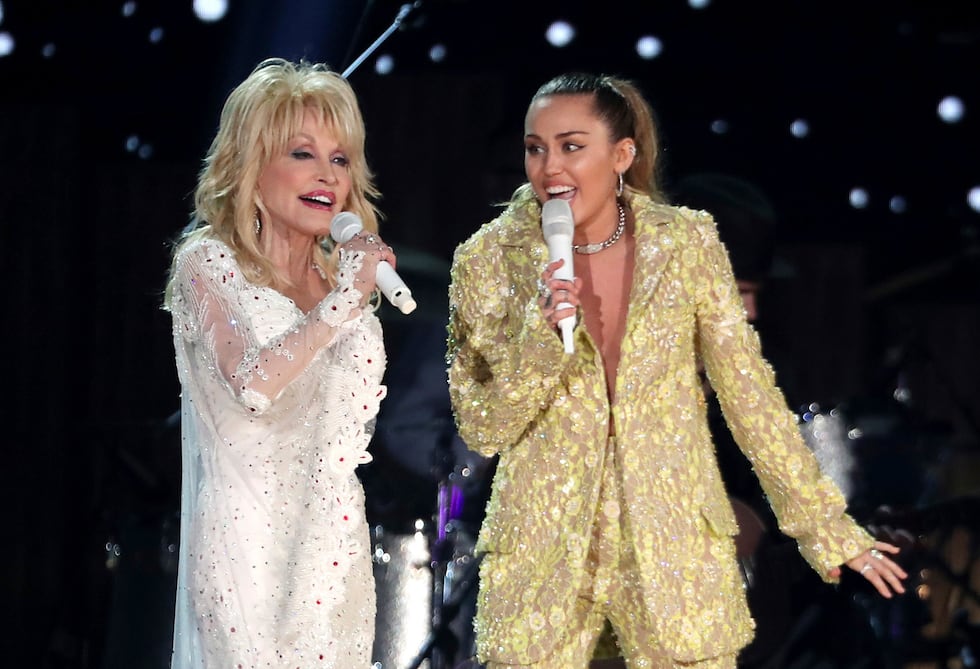 FILE - Dolly Parton, left, and Miley Cyrus perform "Jolene" at the 61st annual Grammy Awards...