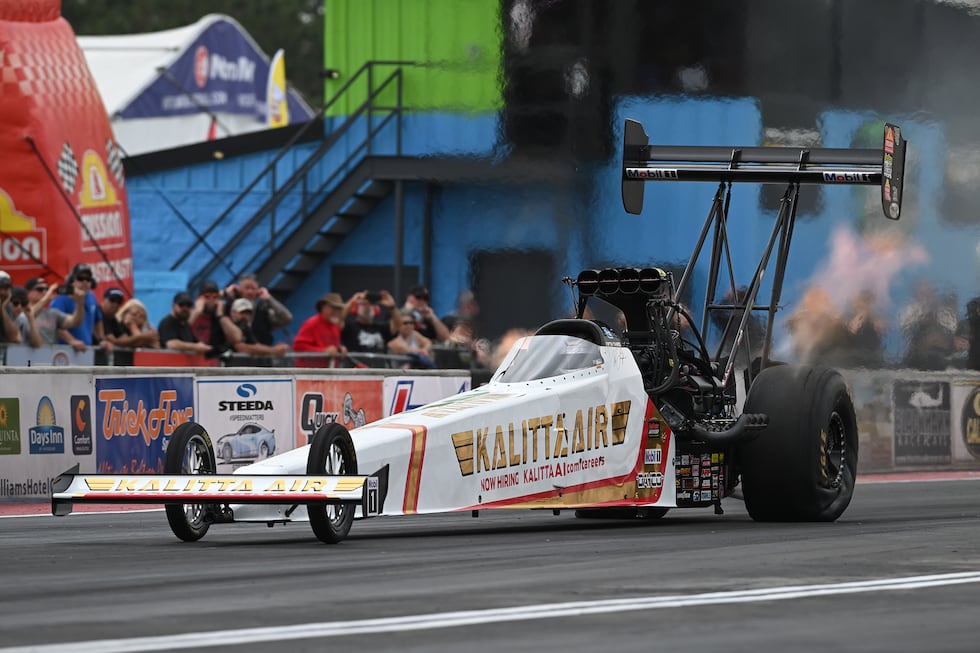 In this photo provided by the NHRA, Top Fuel's Shawn Langdon sets a new NHRA speed record...