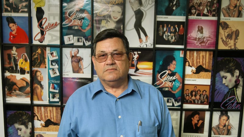Abraham Quintanilla, father of deceased Tejano singer Selena, stands in front of a wall...
