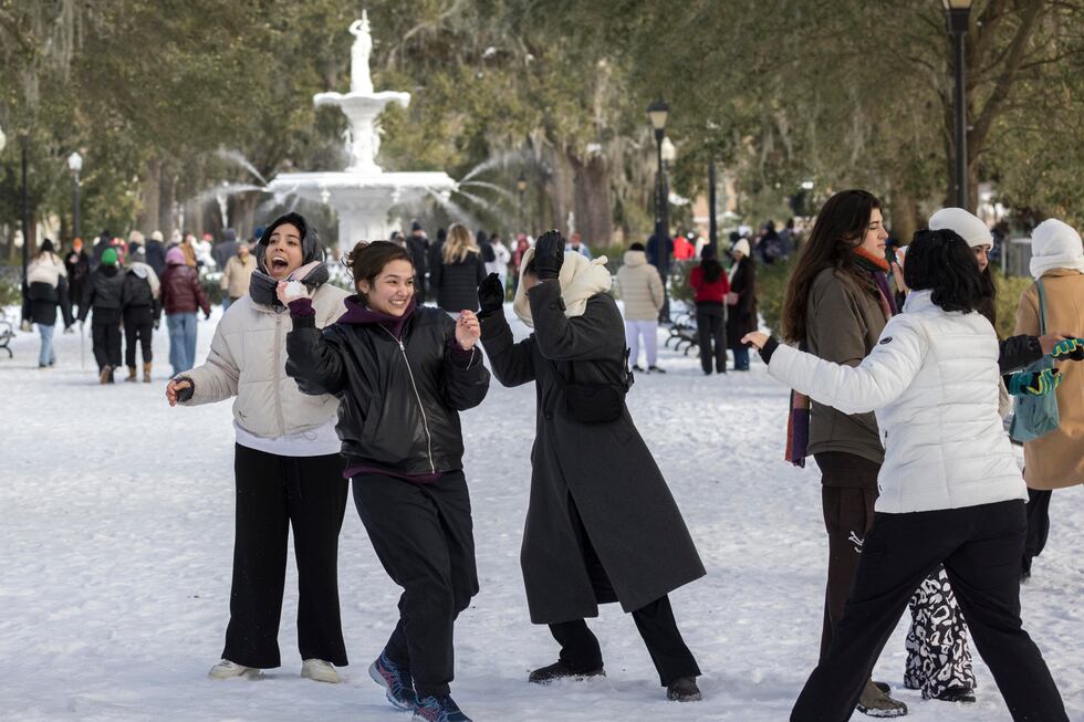A group of Savannah College of Art and Design students have a snowball fight near the historic...
