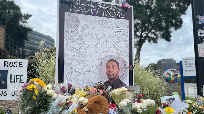 A memorial for Ofc. David Rose with DeKalb County grew outside CDC headquarters. Rose was...