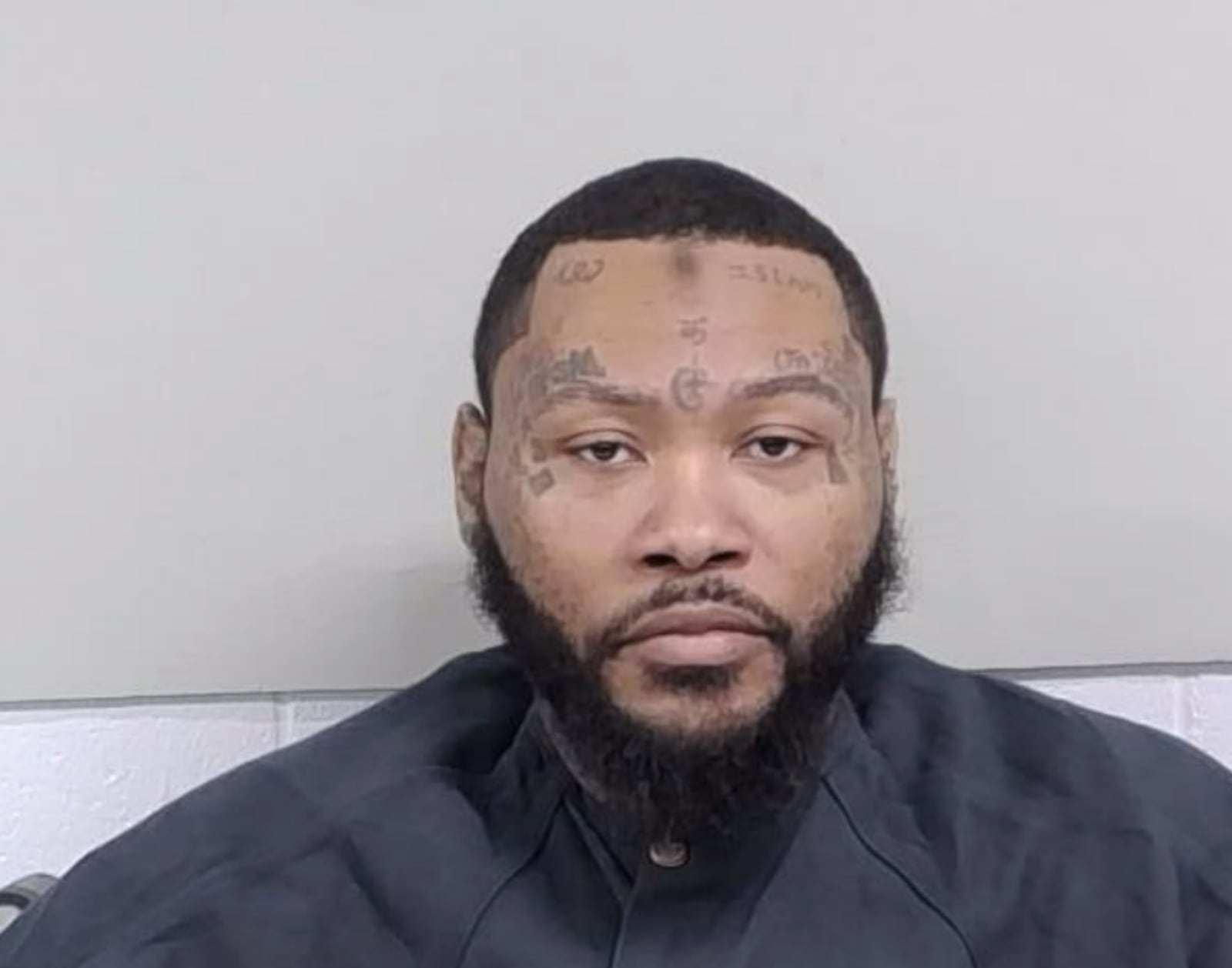 Tevin Jay Love, 32, is facing charges for allegedly beating a woman inside a Dollar General...