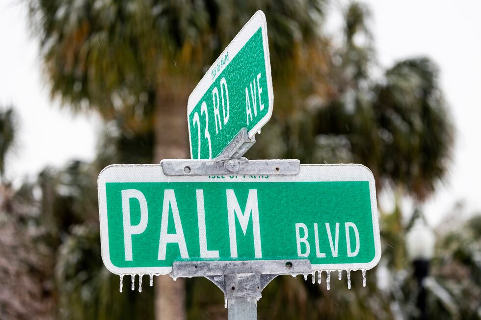 A street sign is covered in ice after a winter storm passed by Wednesday, Jan. 22, 2025, on...