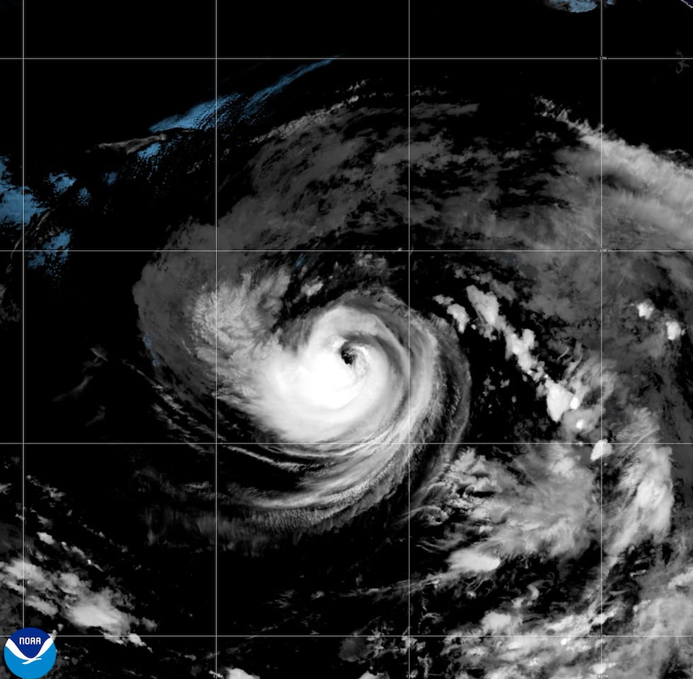 This satellite image released by NOAA shows Hurricane Karina strengthening off the southern...