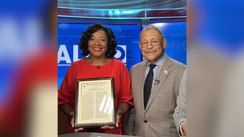 WALB Chief Meteorologist Yolanda Amadeo (left) poses next to Congressman Sanford Bishop (right).