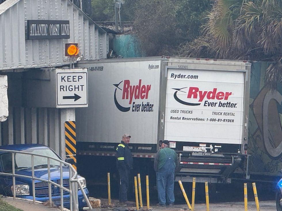 A Ryder box truck got stuck under the East Broad Ave. railroad overpass Monday