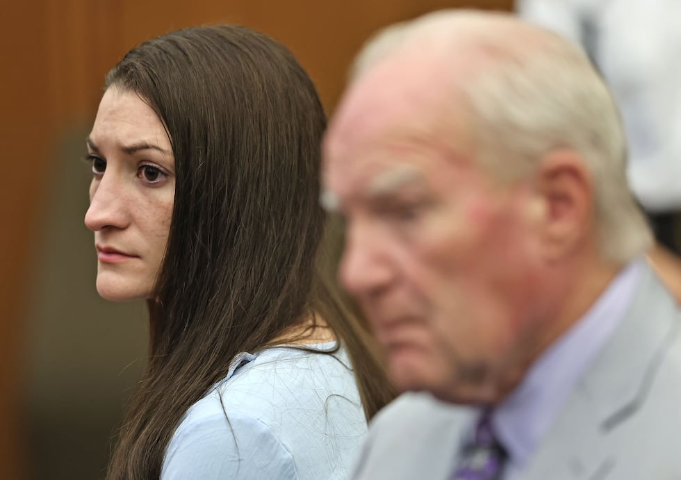 Lindsay Clancy and attorney Kevin Reddington watch as Judge William Sullivan tells the jury to...