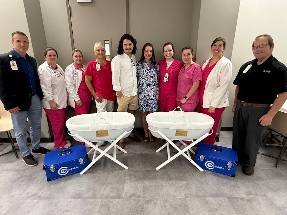 Taylor and Sarah Hutchinson pictured with the SGMC Health Women & Children's team and the two...