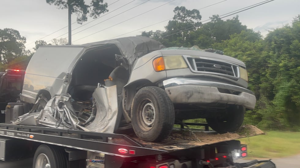 Officials say the vehicle that left the roadway and struck a tree was a 15-passenger van that...