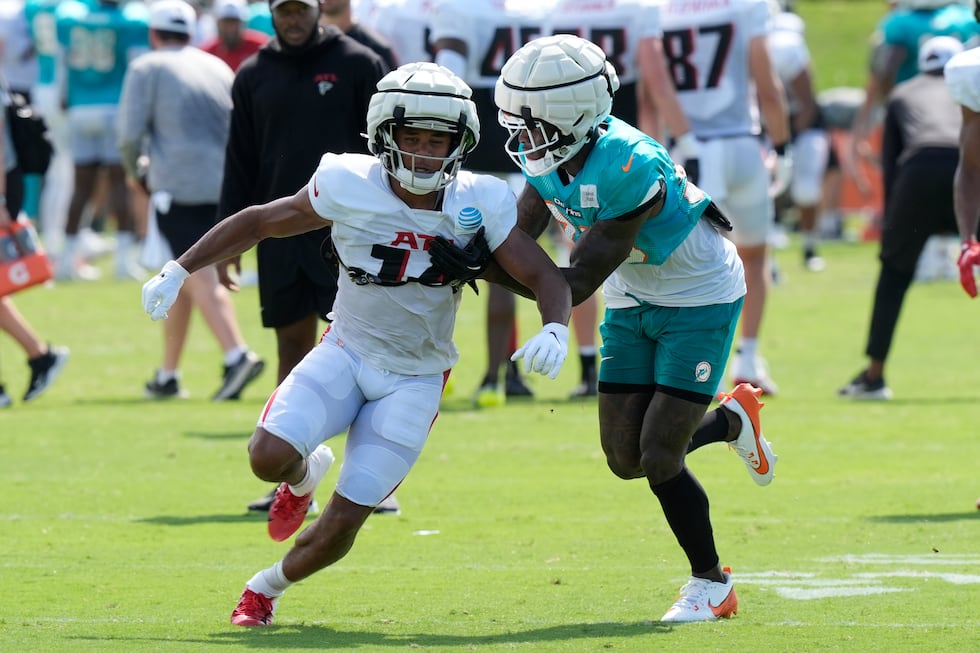 Miami Dolphins cornerback Siran Neal defends Atlanta Falcons wide receiver Rondale Moore (14)...