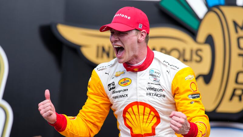 Josef Newgarden celebrates after winning the Indianapolis 500 auto race at Indianapolis Motor...