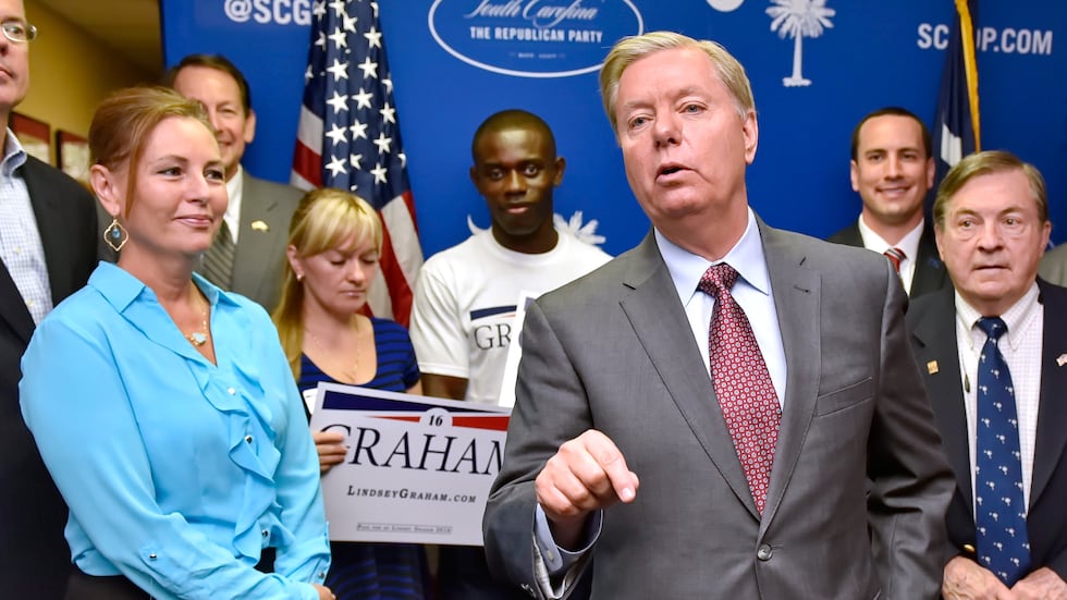 FILE - Republican presidential candidate, Sen. Lindsey Graham, R-S.C., accompanied by his...