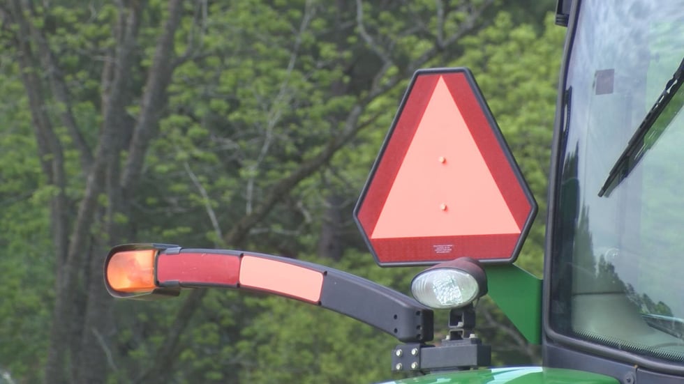 Signs like this one must be installed on the back of a golf cart. This Slow Moving Vehicle...