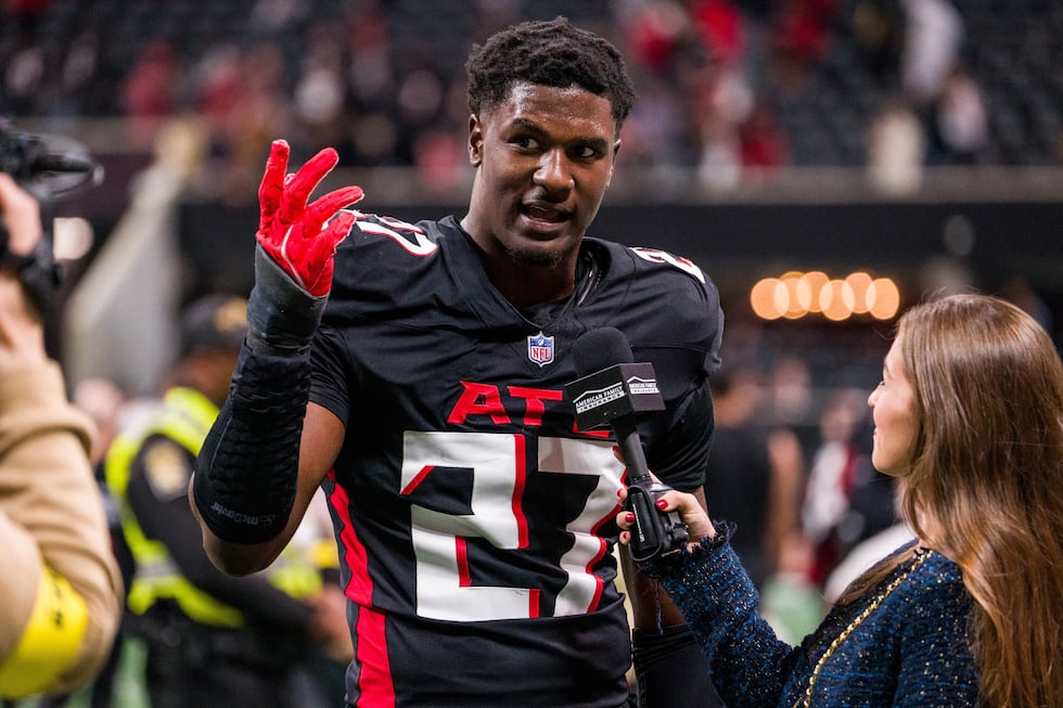FILE - Atlanta Falcons linebacker James Pearce Jr. (27) is interviewed after an NFL football...