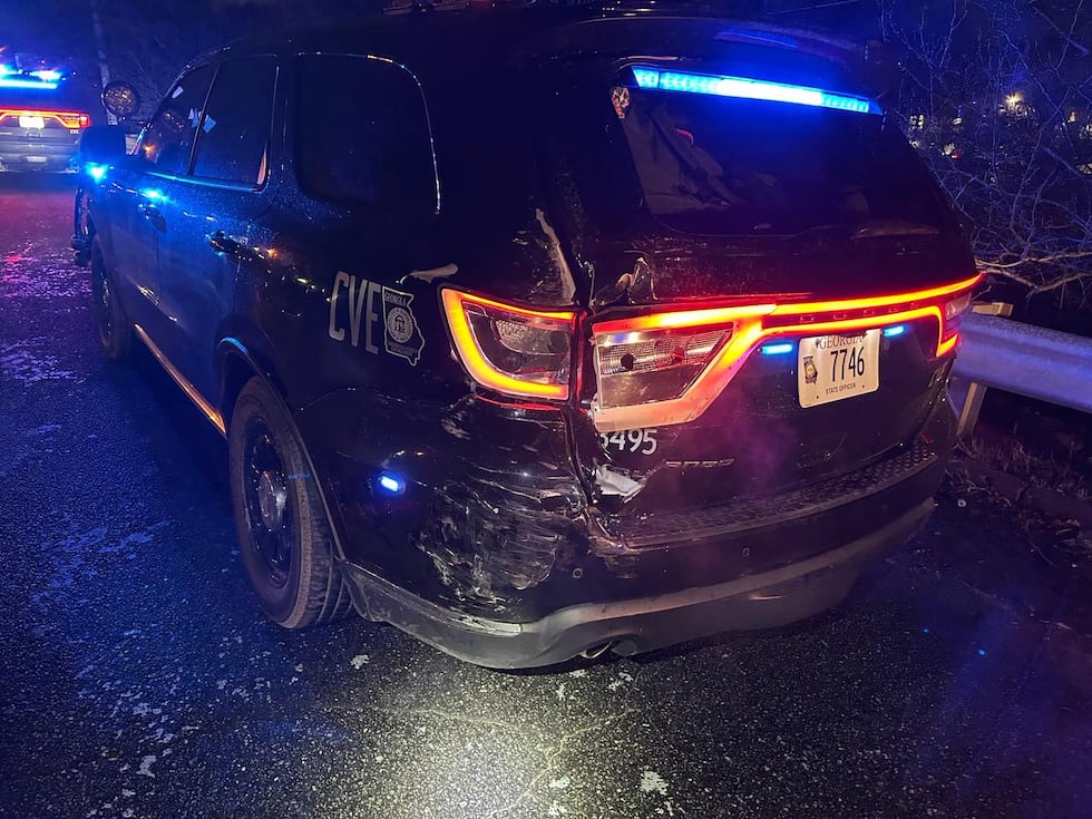 The vehicle was struck while escorting trucks that were treating roadways before the ice storm.