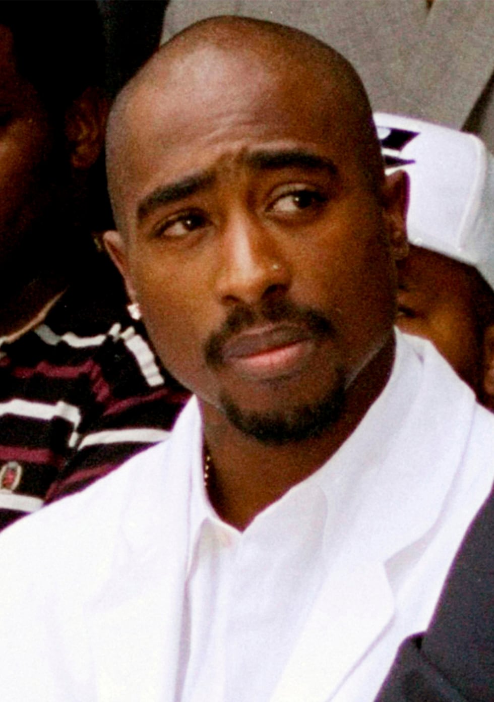 FILE - Rapper Tupac Shakur attends a voter registration event in South Central Los Angeles,...