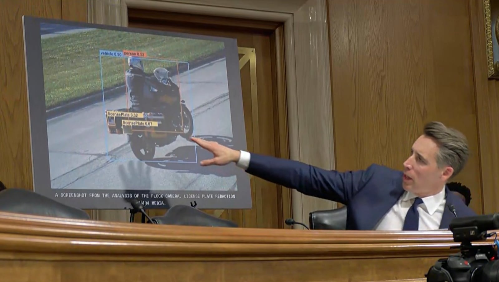 Sen. Josh Hawley points to an image captured by a modern automated license plate reader.
