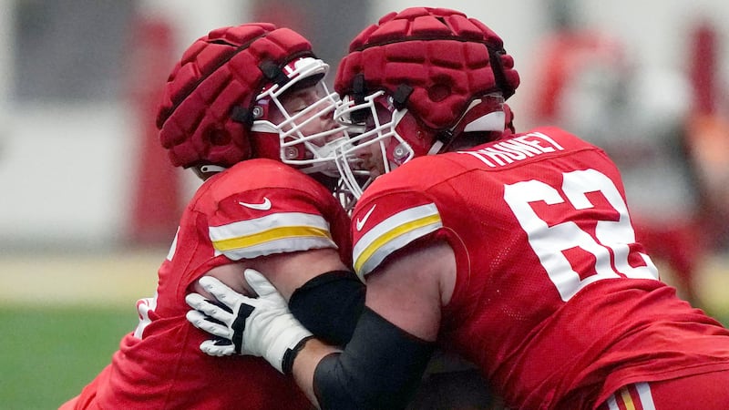FILE - Kansas City Chiefs guard Vitaliy Gurman, left, and outside linebacker Joe Thuney (62)...