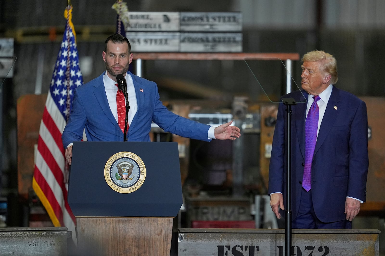 Congressional candidate Clay Fuller speaks as President Donald Trump listens at a rally at...