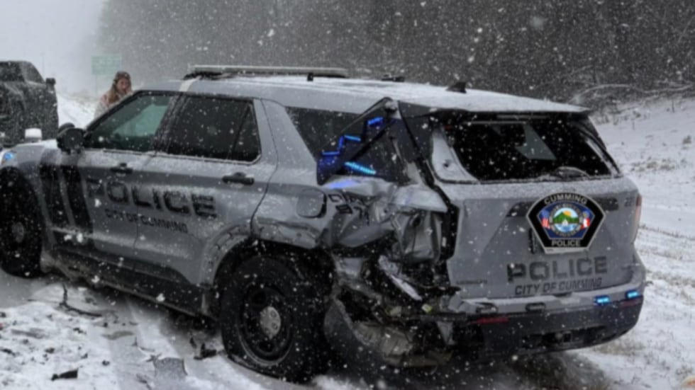 Cumming police vehicle hit in snow