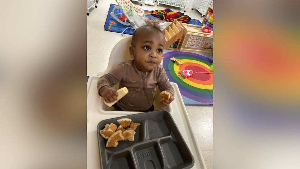 Child left in hot car dies