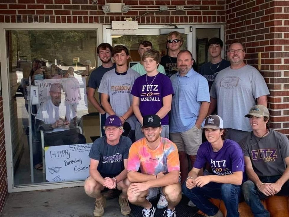Members of the Fitzgerald Baseball Team visits Coach John Owens during his stay at a nursing home