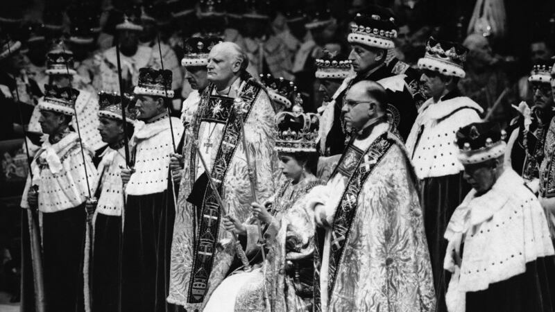 Britain's Queen Elizabeth II is crowned the Monarch of Britain holding the Royal Scepter, sat...