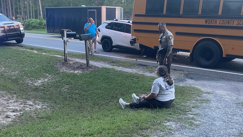 A driver was hospitalized and charged after rear-ending a stopped Worth County school bus on...