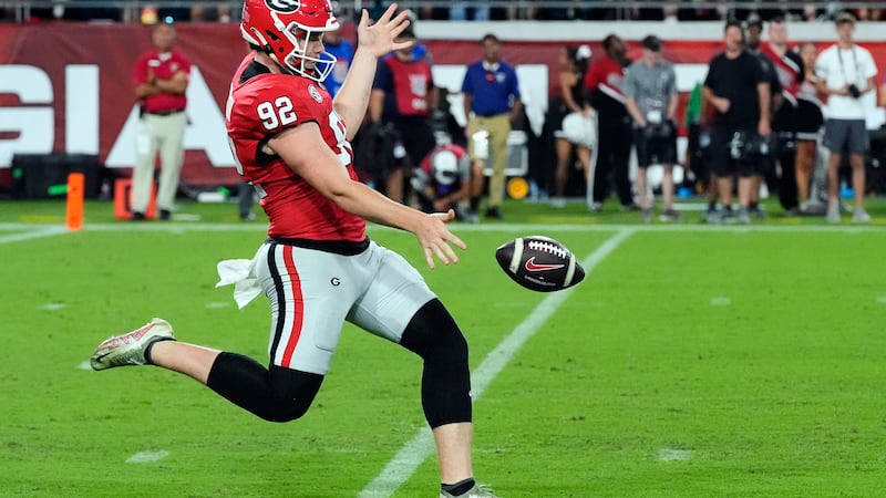 FILE - Georgia punter Brett Thorson (92) kicks against Florida during the second half of an...