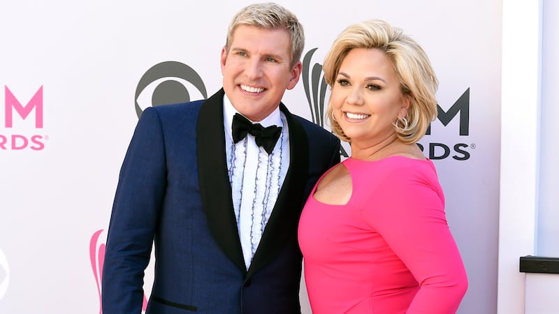 FILE - Todd Chrisley, left, and his wife, Julie Chrisley, pose for photos at the 52nd annual...
