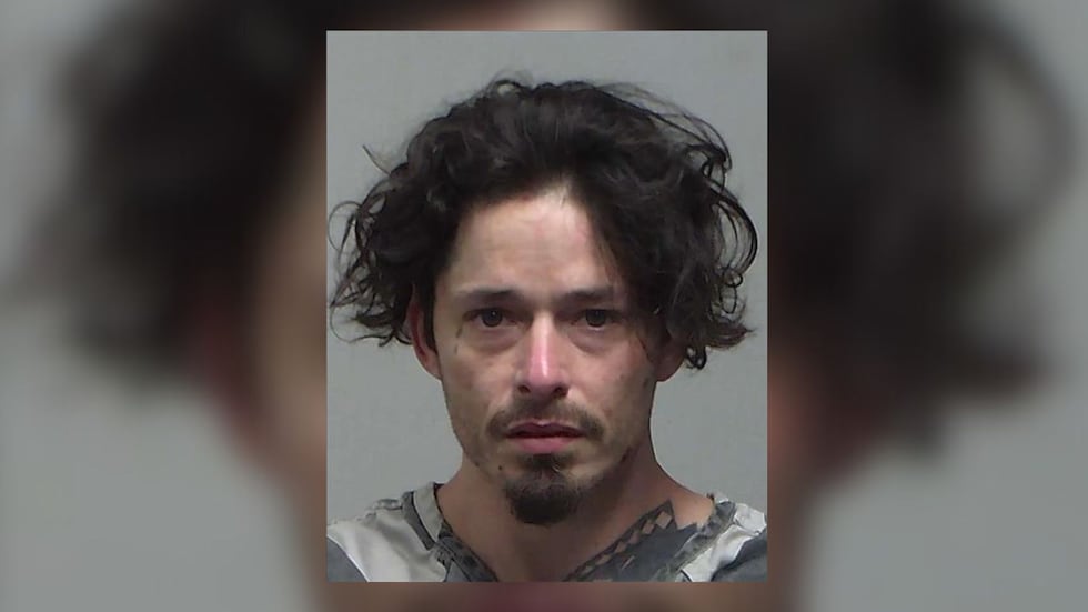 Joshua Dunkleberger, 37, was arrested after carrying a hatchet near the Tifton Mall, TPD said.