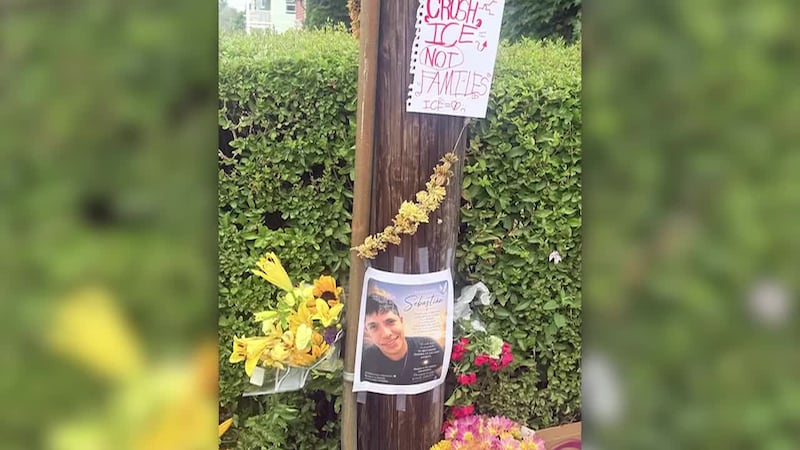 A memorial forms on the street corner in Maine where ICE officers shot and killed a...